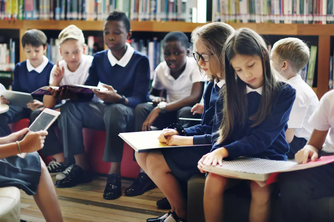 A reading lesson in the library at North Broward Preparatory School Elementary students at North Broward Preparatory School take a reading lesson in the library — American Butler