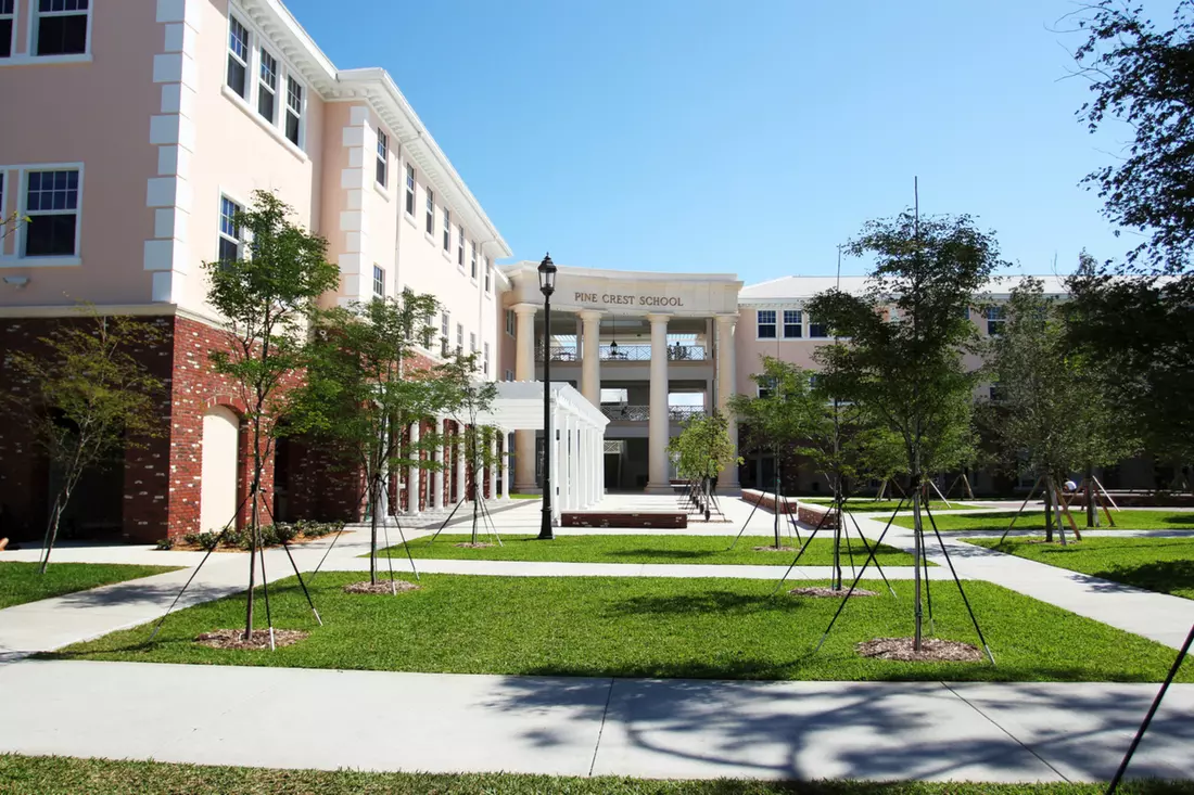 Pine Crest School grounds and building are a place for study and relaxation Pine Crest School courtyard with greenery and light building