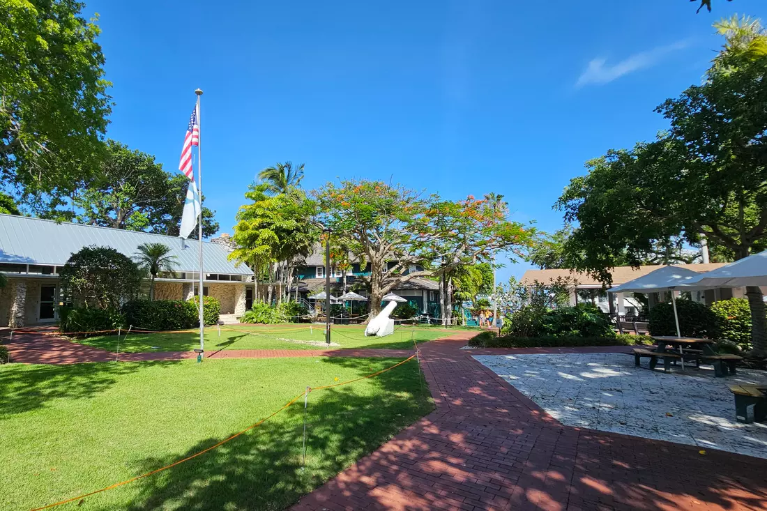 Green campus of private school Ransom Everglades in Miami Ransom Everglades School Campus with US Flag