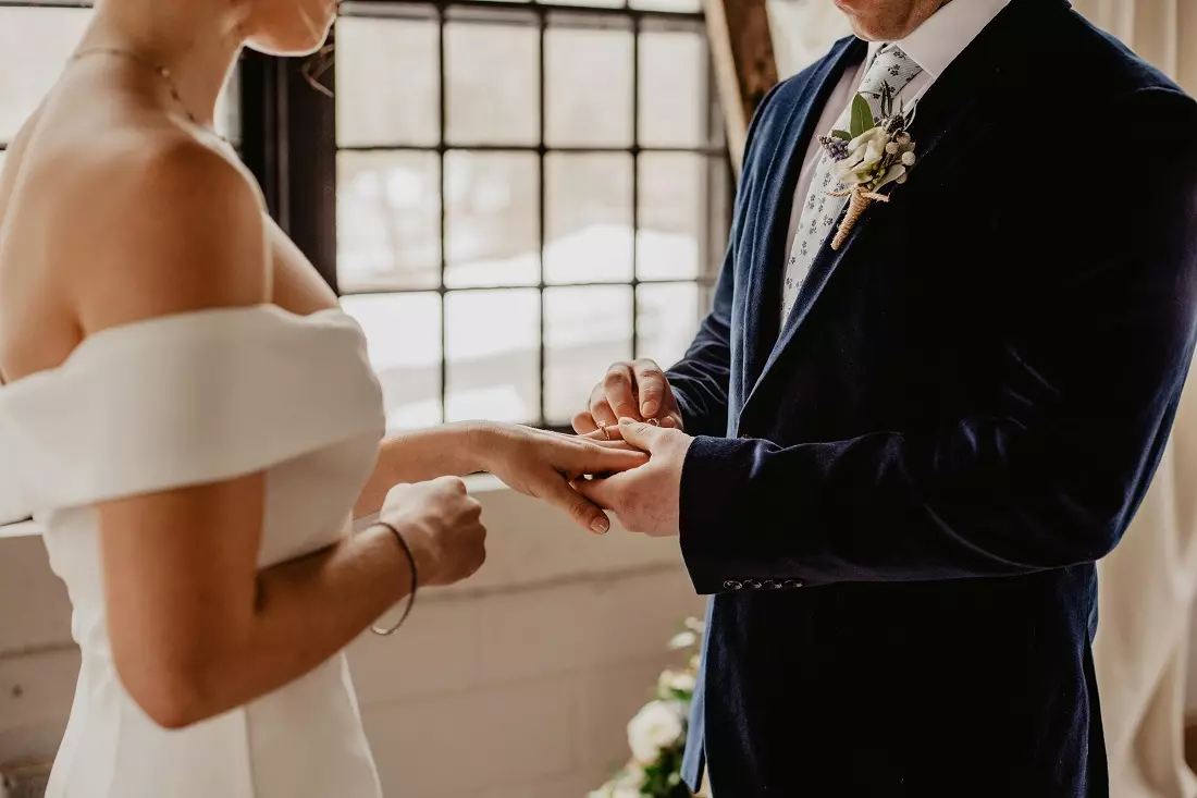 Wedding in a boutique hotel Bride and groom exchanging rings in a boutique hotel