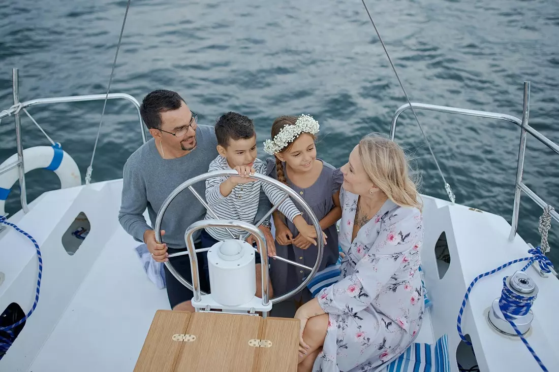 Family during a yacht trip Happy family on a yacht trip