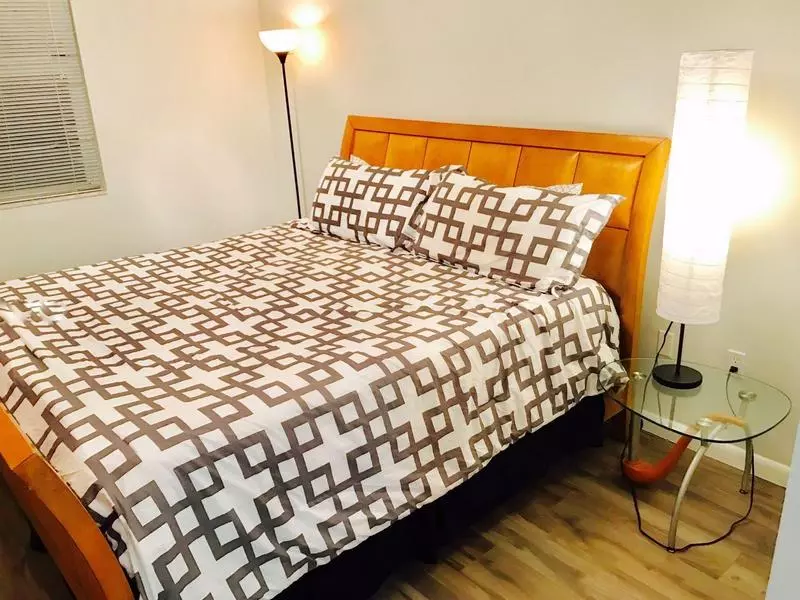 A comfortable bedroom in a Porto Bellagio apartment Cozy bedroom of an apartment in Porto Bellagio