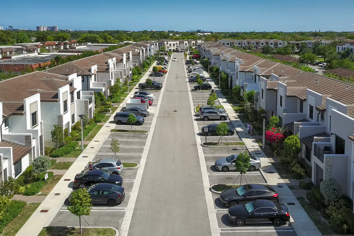 Panoramic view of the Via Ventura residential complex from above Via Ventura residential street with parking and townhouses