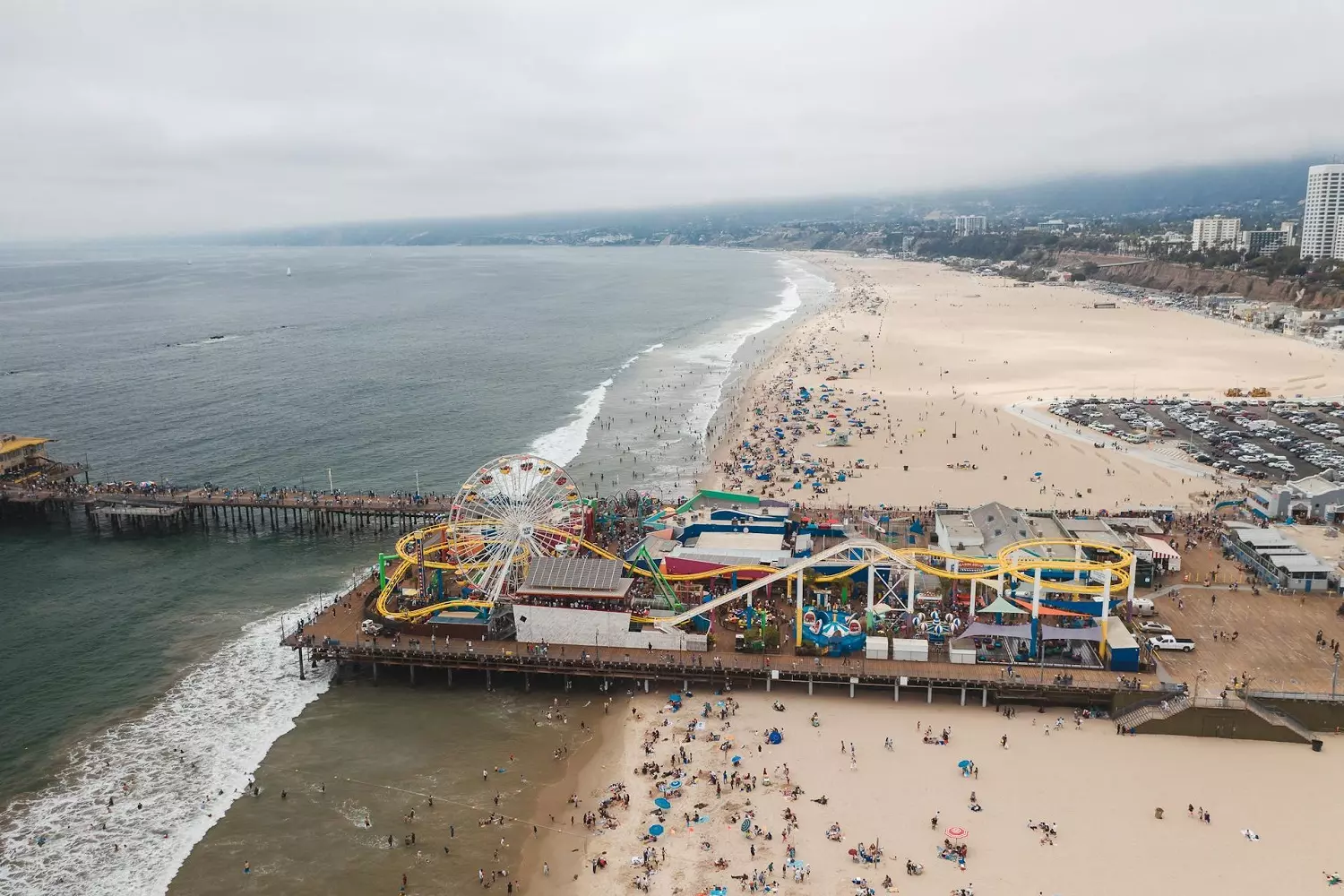Panoramic view of Santa Monica Pier A panoramic view of Santa Monica Pier with attractions and bustling crowds