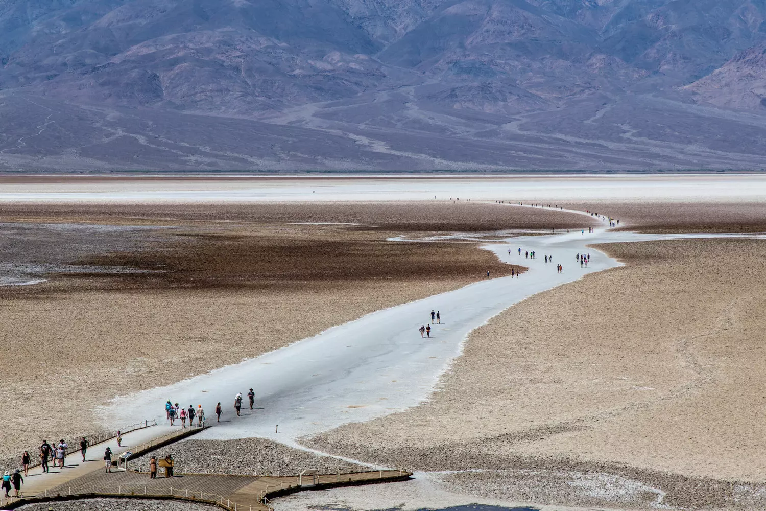 Death Valley — Alien Landscapes of Earth's Hottest Place | Photo Surreal landscapes of Death Valley: golden dunes, salt flats and mountains under scorching sun