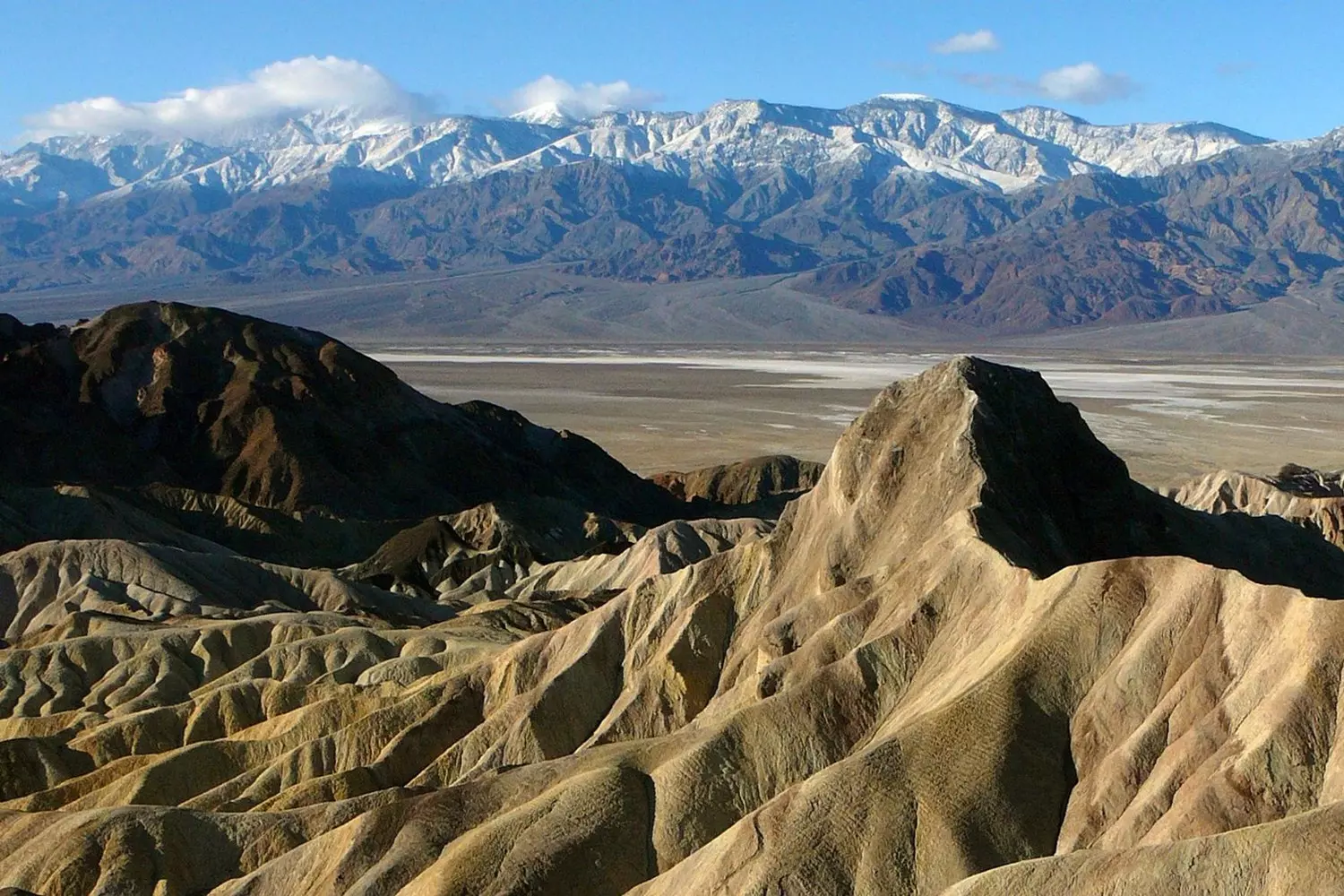 Death Valley Mountains — Colorful Cliffs & Martian Landscapes Dramatic mountain ranges of Death Valley: wind-carved layered rocks under the desert sun
