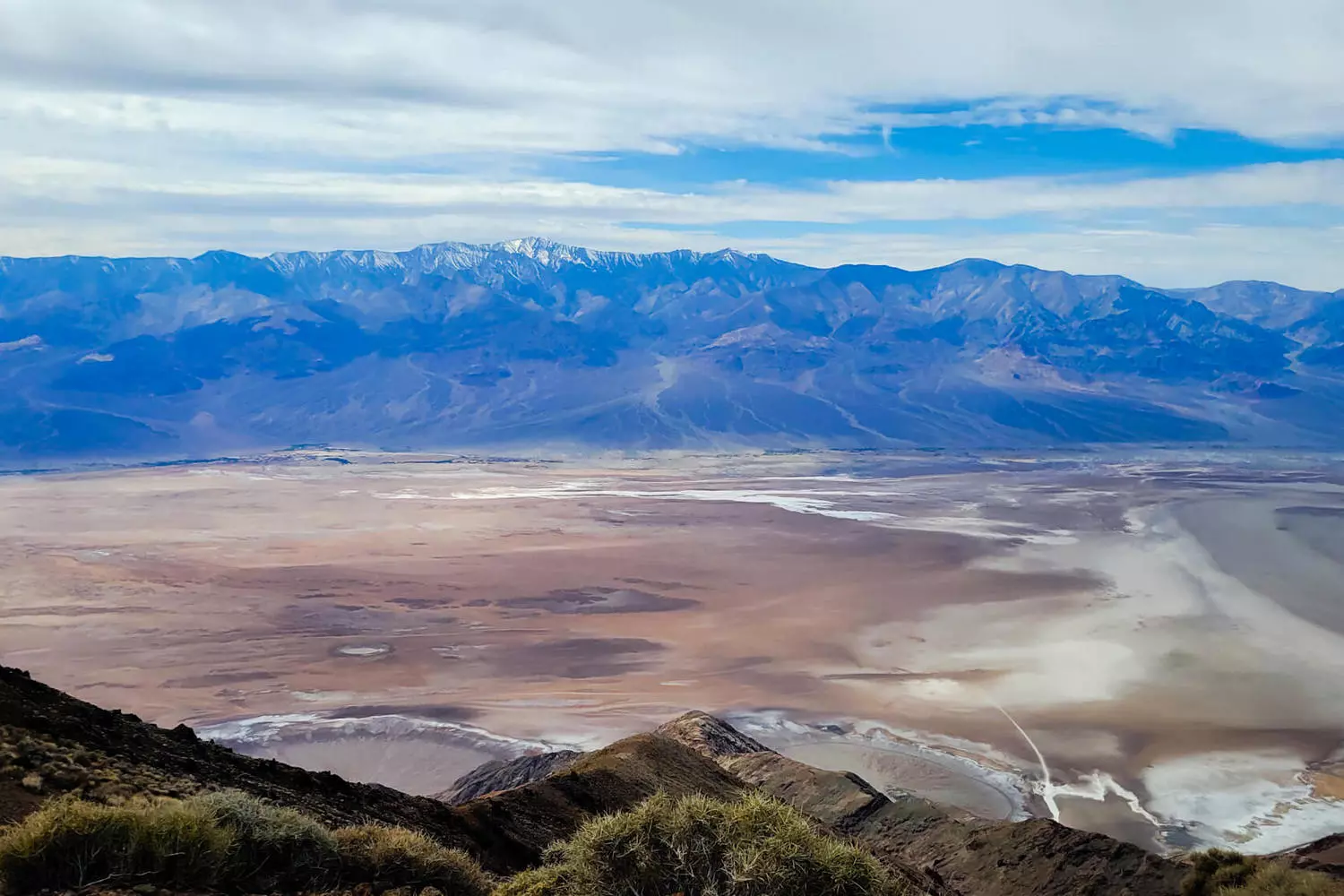 Death Valley Mountains — Colorful Cliffs & Martian Landscapes Dramatic mountain ranges of Death Valley: wind-carved layered rocks under the desert sun