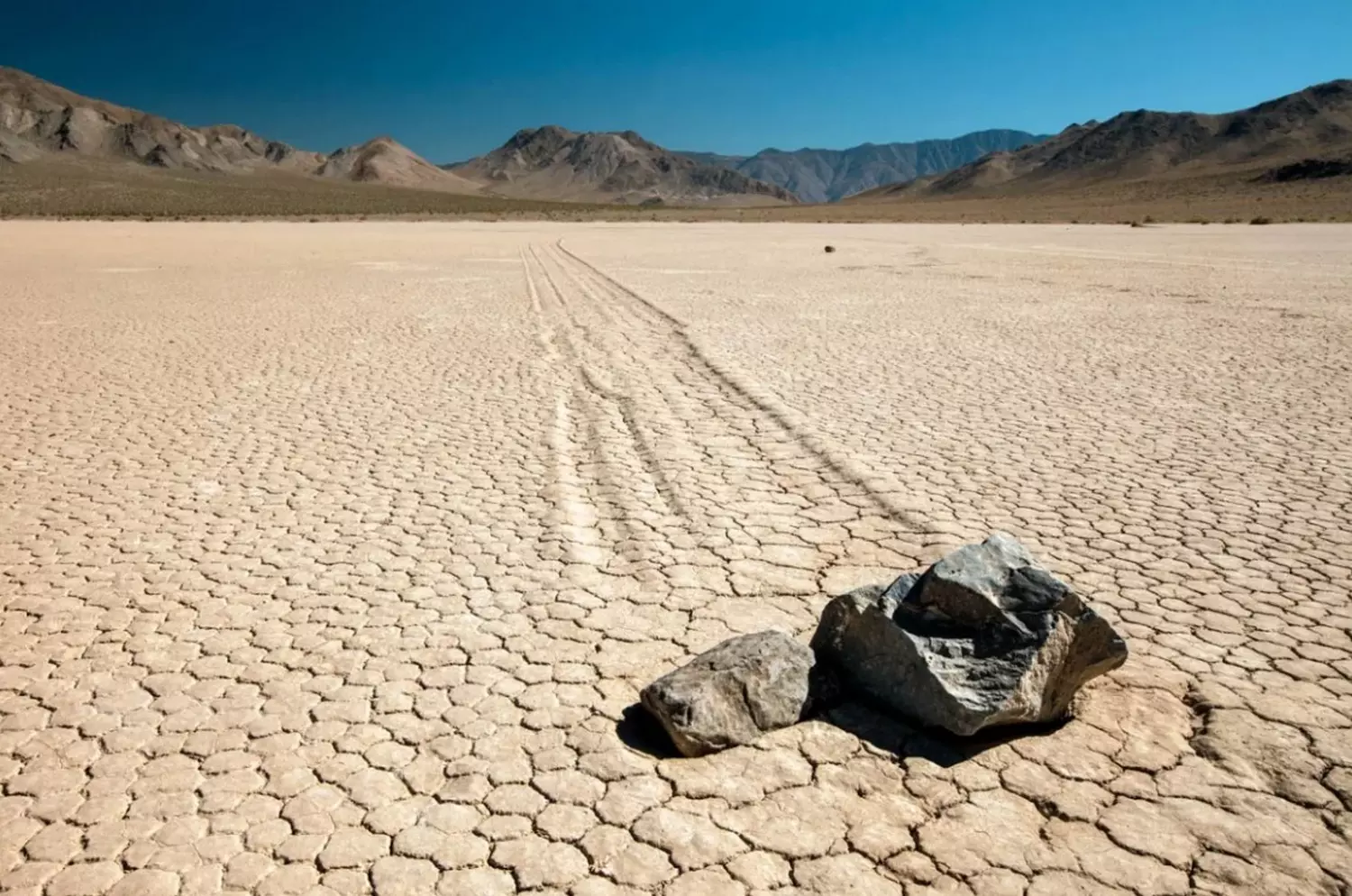 Death Valley's Moving Rocks: Solving Nature's Centuries-Old Mystery Mysterious sailing stones at Racetrack Playa in Death Valley: enigmatic trails on dry lake bed
