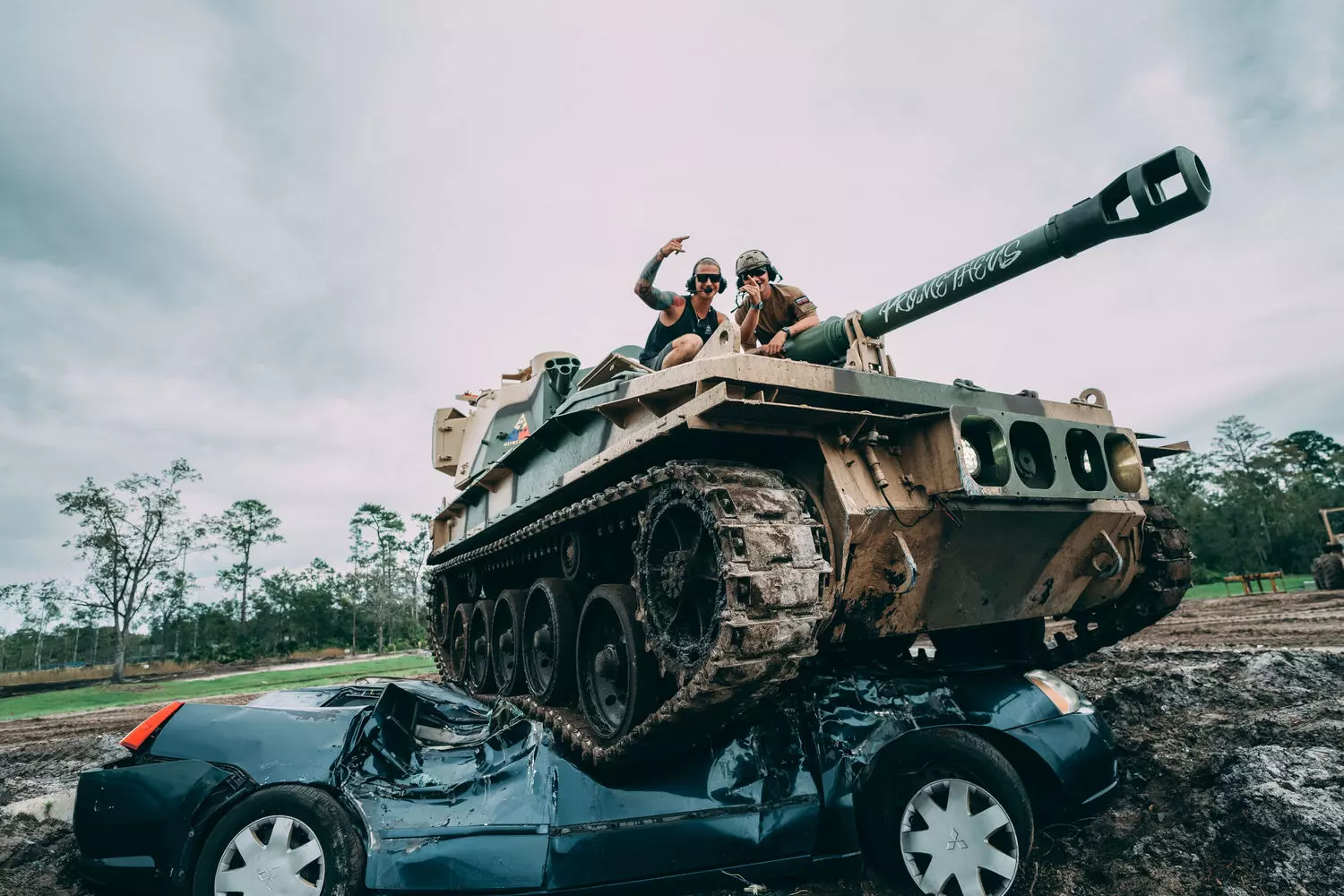 Drive a real tank and crush a car during an extreme tour in Florida Florida tank tour — tank crushing a car under its tracks