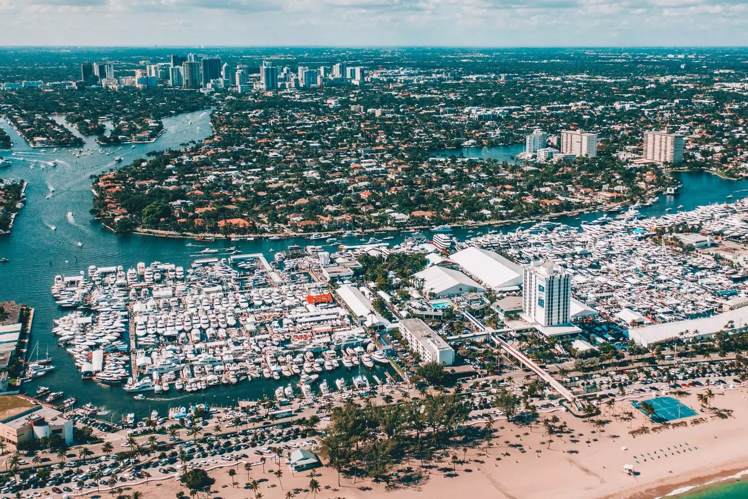Fort Lauderdale from Above: Paradise Landscapes from the Air A breathtaking drone view of Fort Lauderdale: a network of canals with yachts, golden beaches, turquoise ocean waters, and urban districts framed by palm trees — the perfect panorama of Florida's coastline