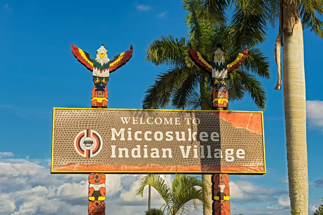 Miccosukee Indian Village Near Miami Photo of a sign for the Miccosukee Indian Village near Miami — American Butler