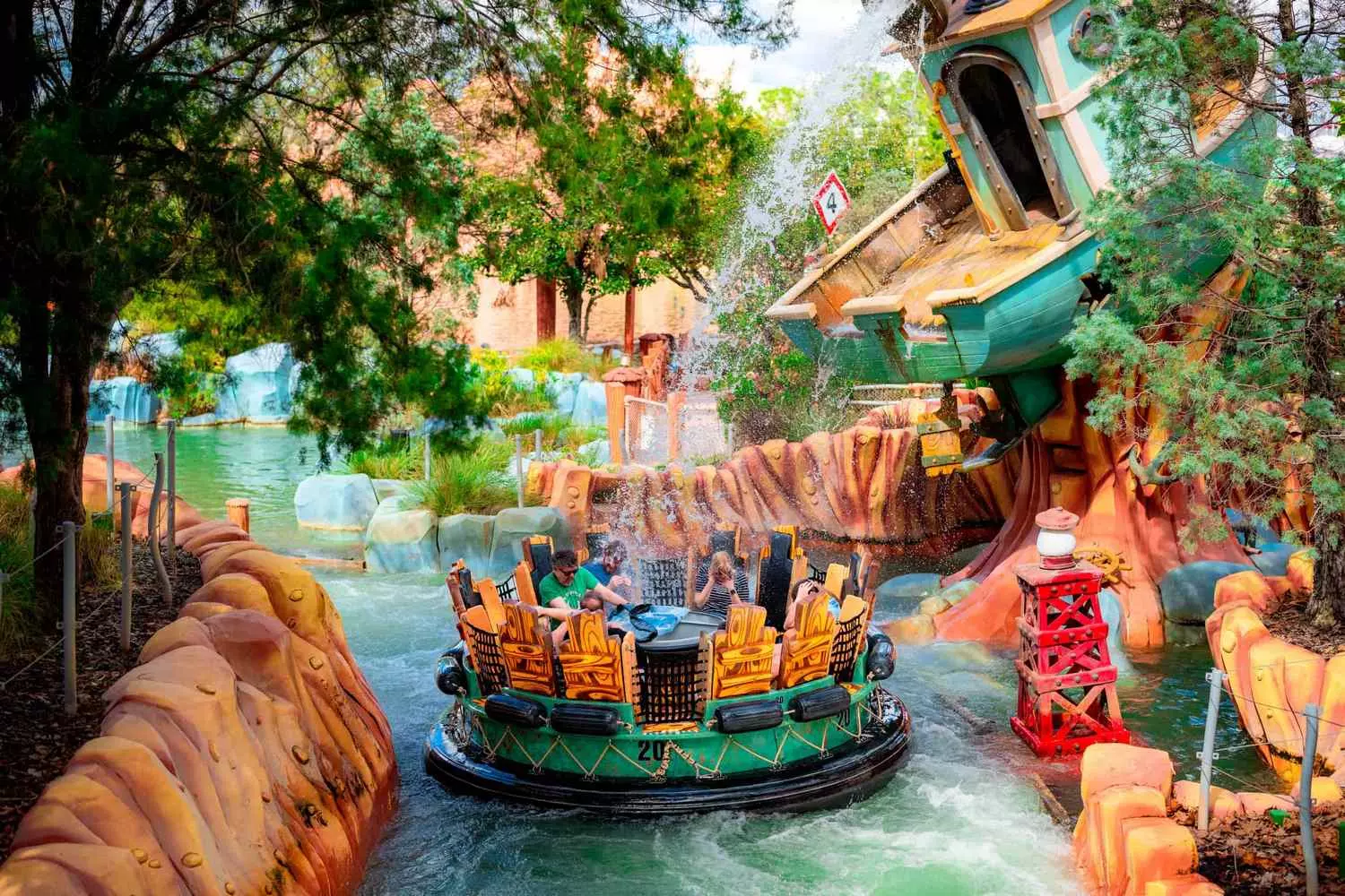 Exciting Water Ride Adventure at Universal Orlando — Cool Fun in the Sunshine Guests splashing down on a water ride at Universal Orlando Resort under the Florida sun