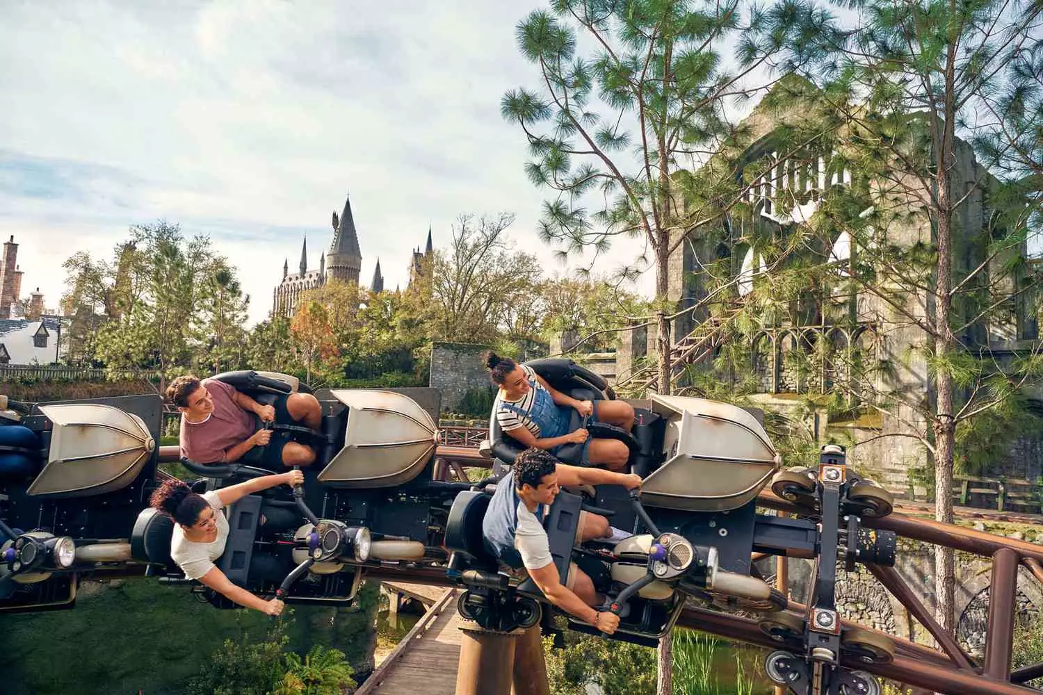 Hagrid’s Motorbike Adventure — Thrilling Harry Potter Coaster at Universal Orlando Riders speeding through the forest on Hagrid’s Magical Creatures Motorbike Adventure at Universal’s Islands of Adventure