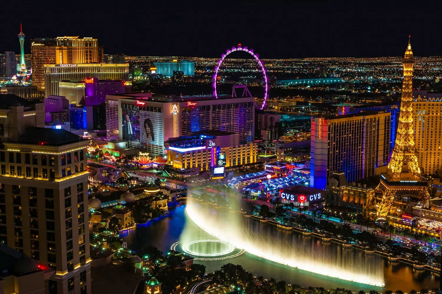 The Eiffel Tower, Bellagio Fountains, and High Roller at Night in Las Vegas Las Vegas at Night: Glittering Lights of The Strip, the Eiffel Tower, and the Bellagio Fountains