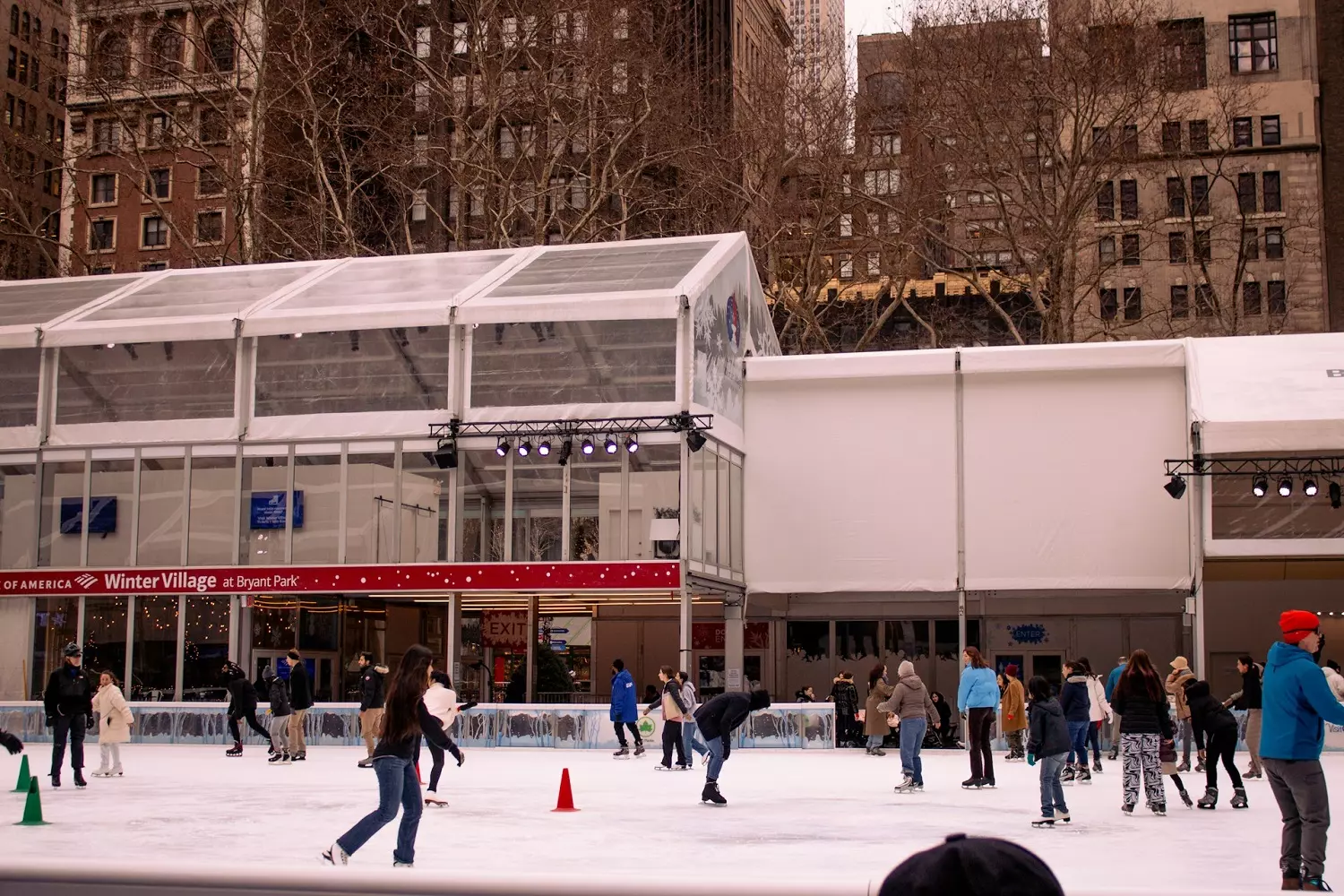 The ice rink in Bryant Park during winter People ice skating in Bryant Park