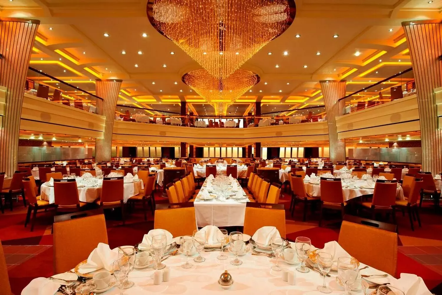 Carnival Breeze Restaurant — Fine Dining & Cruise Elegance Elegant restaurant aboard Carnival Breeze cruise ship featuring gourmet cuisine, stylish table settings and panoramic ocean views