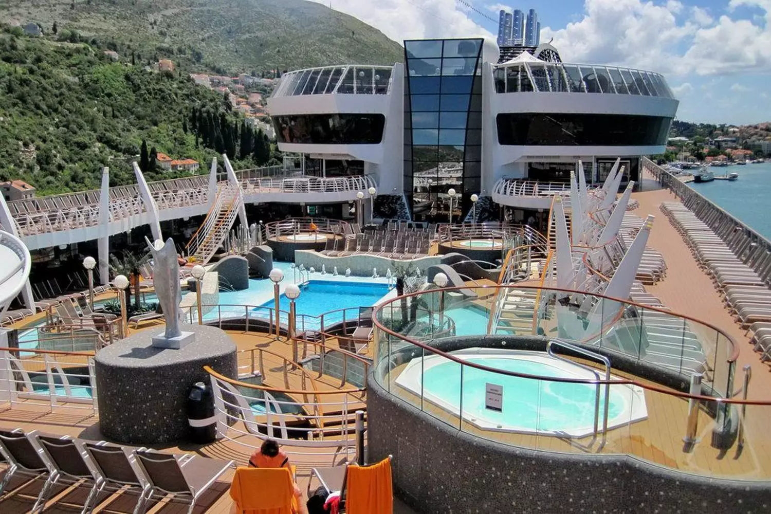 MSC Divina Pool — Relaxation Under the Sun Spacious pool deck on MSC Divina cruise ship with crystal-clear water and sun loungers