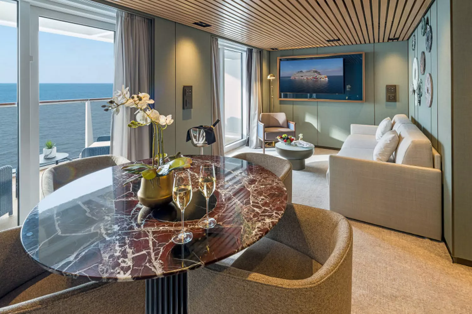 Norwegian Aqua — Stylish Cruise Cabin with Ocean Views Modern and cozy cabin on Norwegian Aqua cruise ship with comfortable bed, elegant decor, and ocean-view window