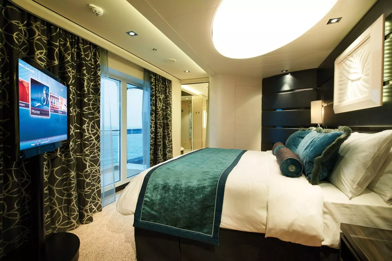 Oceanview staterooms: modern comfort aboard Norwegian Getaway Spacious Norwegian Getaway stateroom with floor-to-ceiling ocean view and contemporary decor