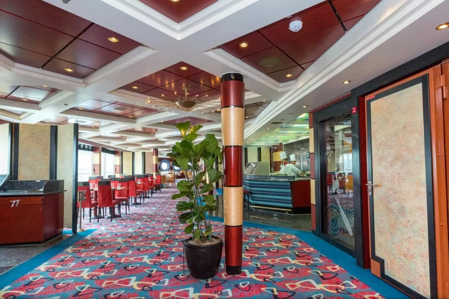 Fine Dining on Norwegian Sun — Gourmet Experience at Sea Elegant restaurant aboard the Norwegian Sun cruise ship with stylish decor, tables set for dining, and ocean views through the windows