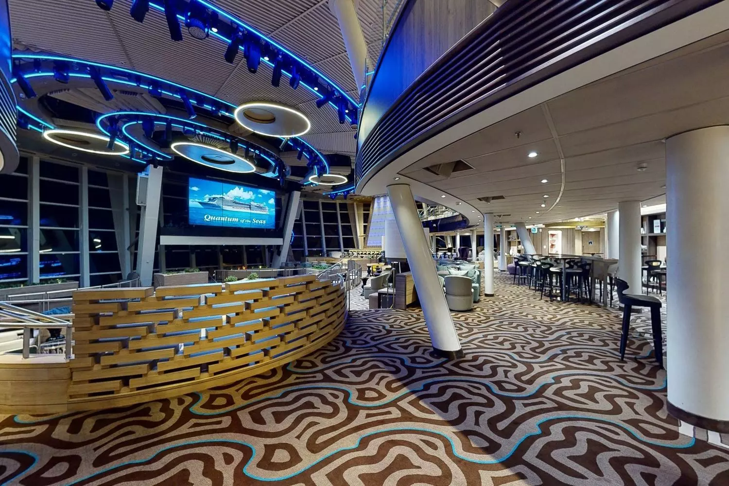 Gourmet Dining at Sea: Quantum of the Seas' Elegant Restaurant Sophisticated dining room aboard Royal Caribbean's Quantum of the Seas cruise ship, featuring elegant decor, white-tablecloth service, and gourmet cuisine in a luxurious maritime setting