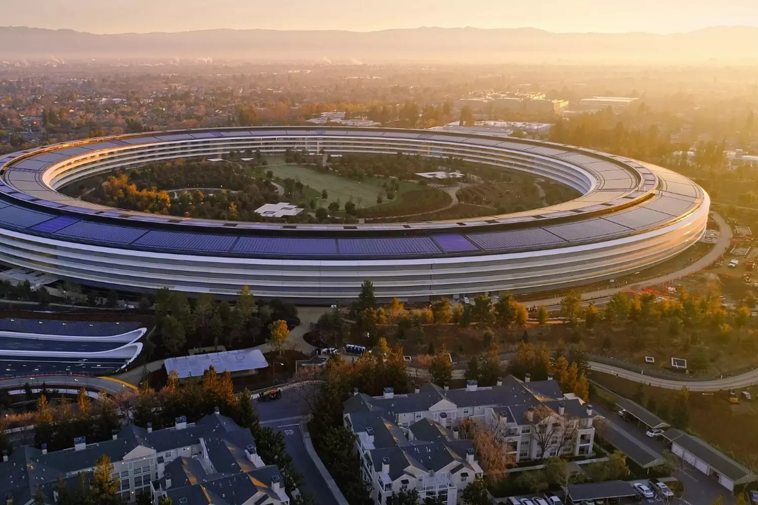 Apple Park — the futuristic headquarters of Apple in the heart of Silicon Valley Aerial view of the Apple Park headquarters in Silicon Valley, shaped like a ring
