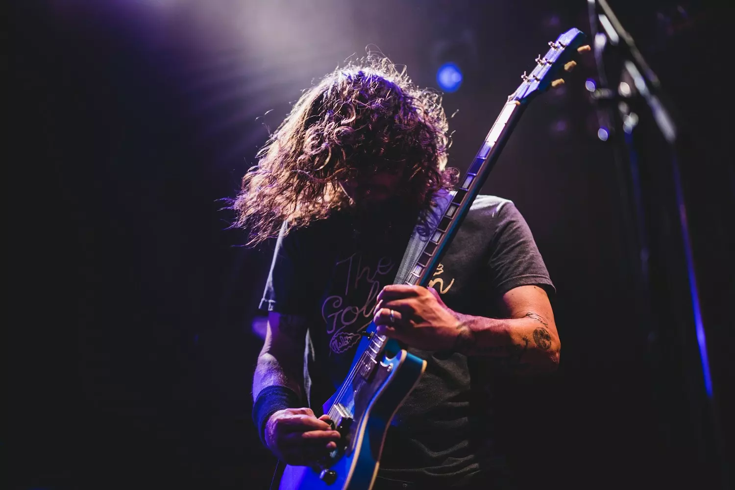 Rocker performing at a concert Musician playing rock music on stage