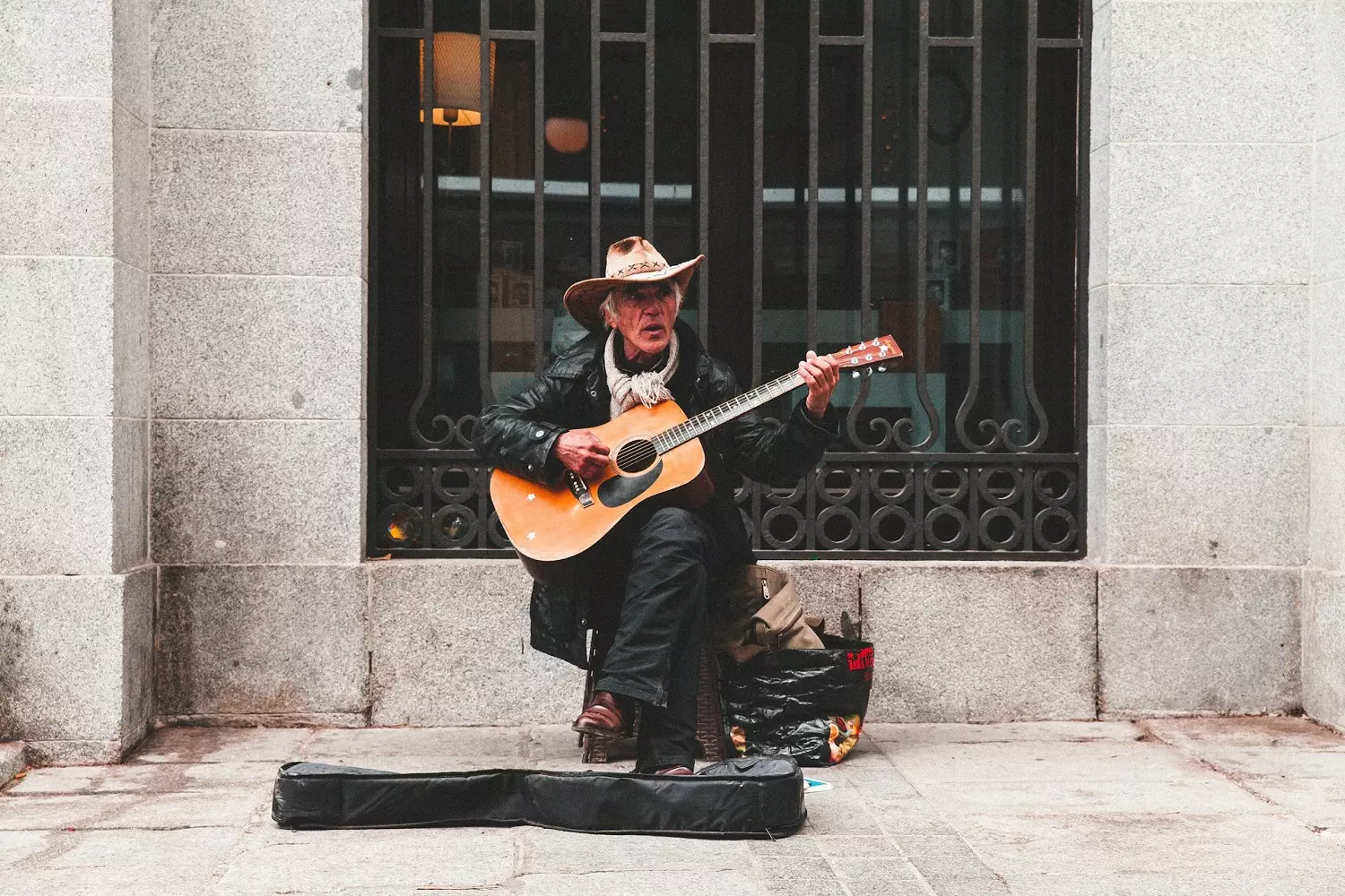 Street musician with a guitar Street country musician with a guitar