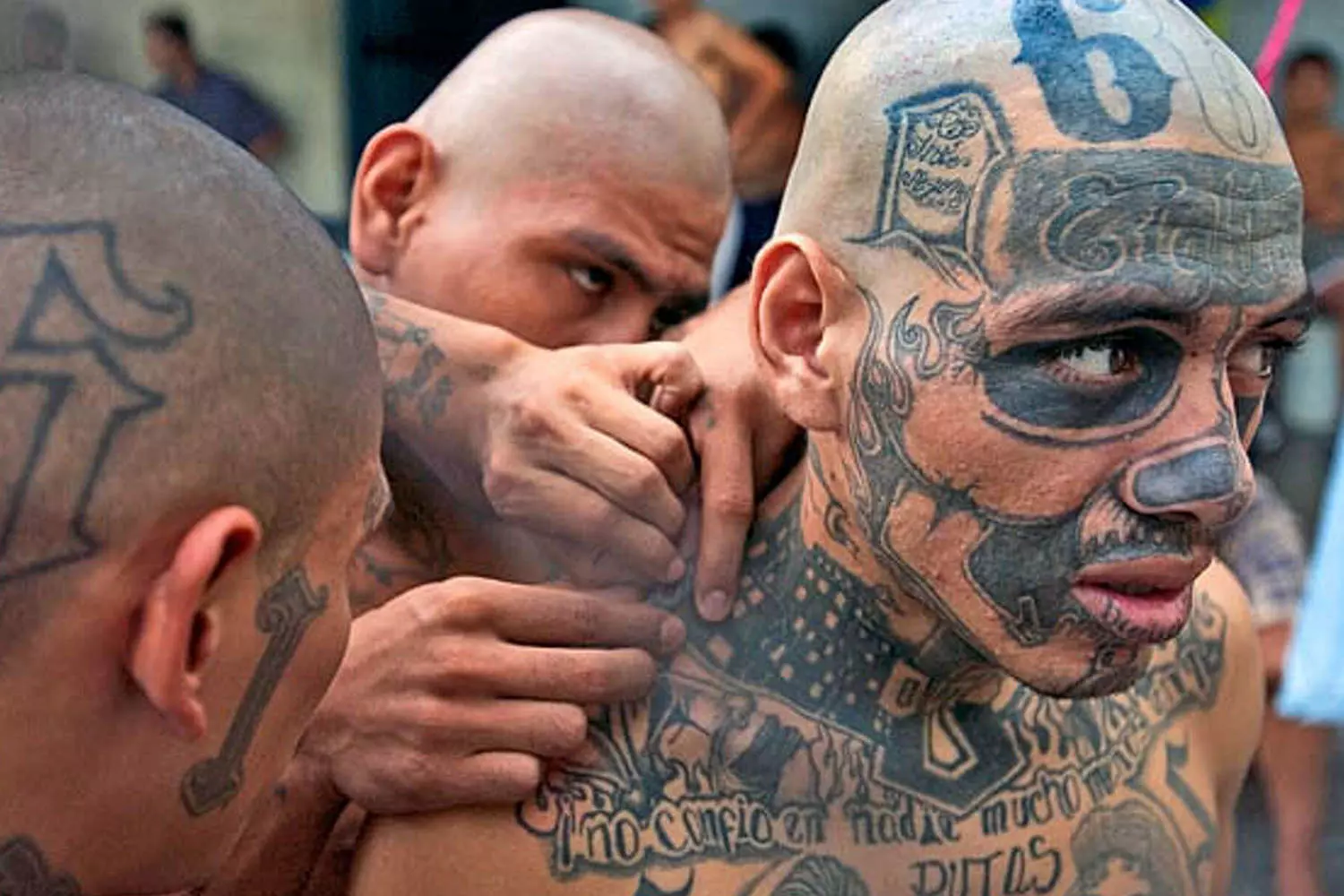 Kings of the Streets: The Unwritten Laws of the American Underground Members of a street gang in the USA stand together, displaying hand signs and wearing their gang’s colors