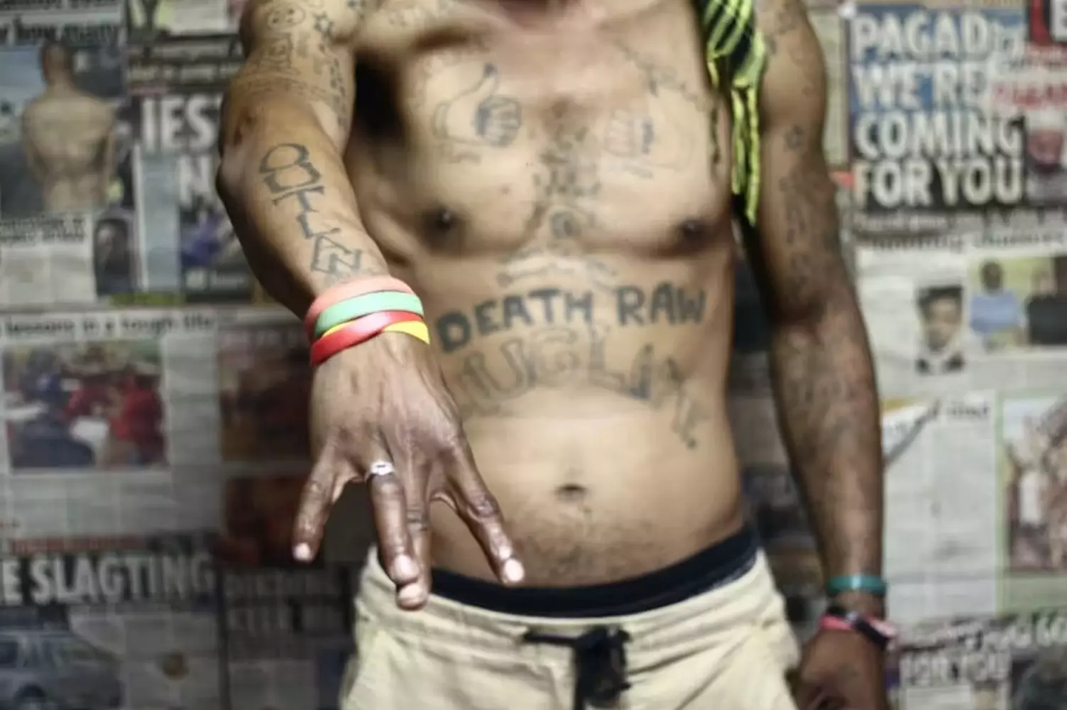 Kings of the Streets: The Unwritten Laws of the American Underground Members of a street gang in the USA stand together, displaying hand signs and wearing their gang’s colors