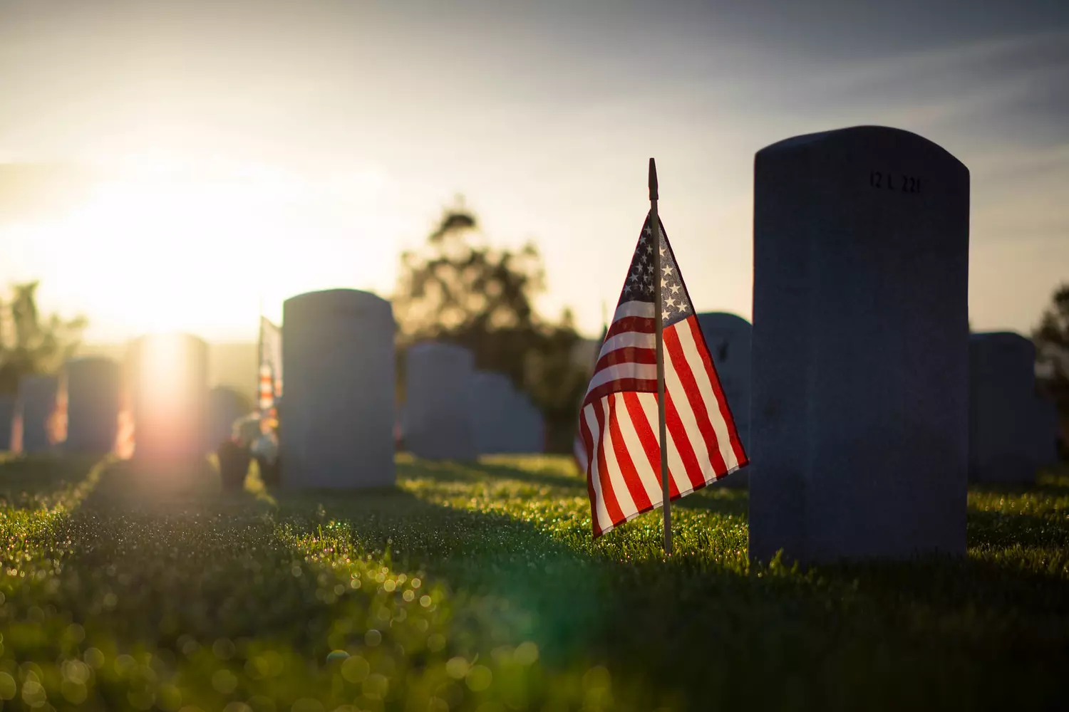 Cemetery Flags to Mark Memorial Day in the US | American Butler Photo of flags at a cemetery in honor of the holiday of remembrance and memory in the USA