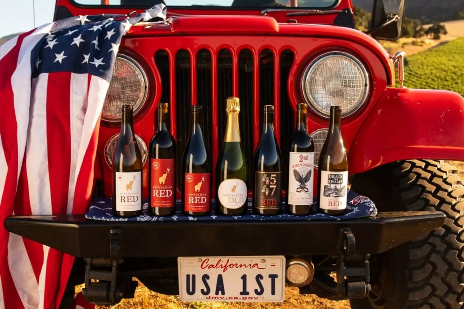 American Spirit in a Glass: Jeep, Flag & California Wine A rugged Jeep parked under the stars with an American flag and a bottle of premium California wine, embodying adventure and luxury