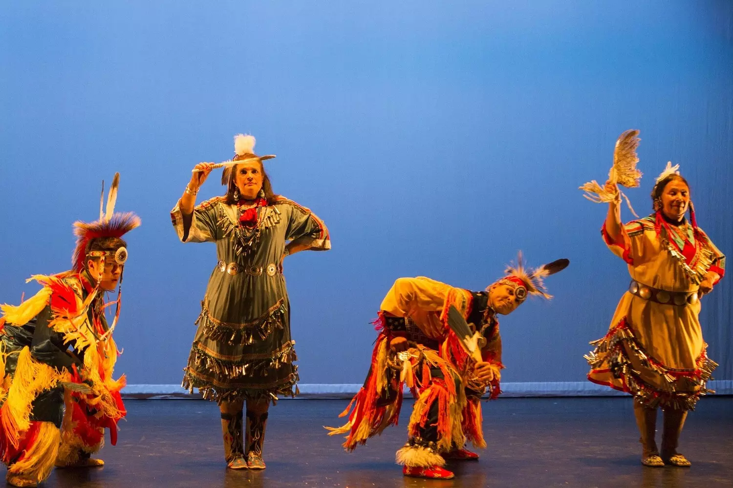 Performance of Native Americans on stage Performance of Indians in traditional costumes on stage