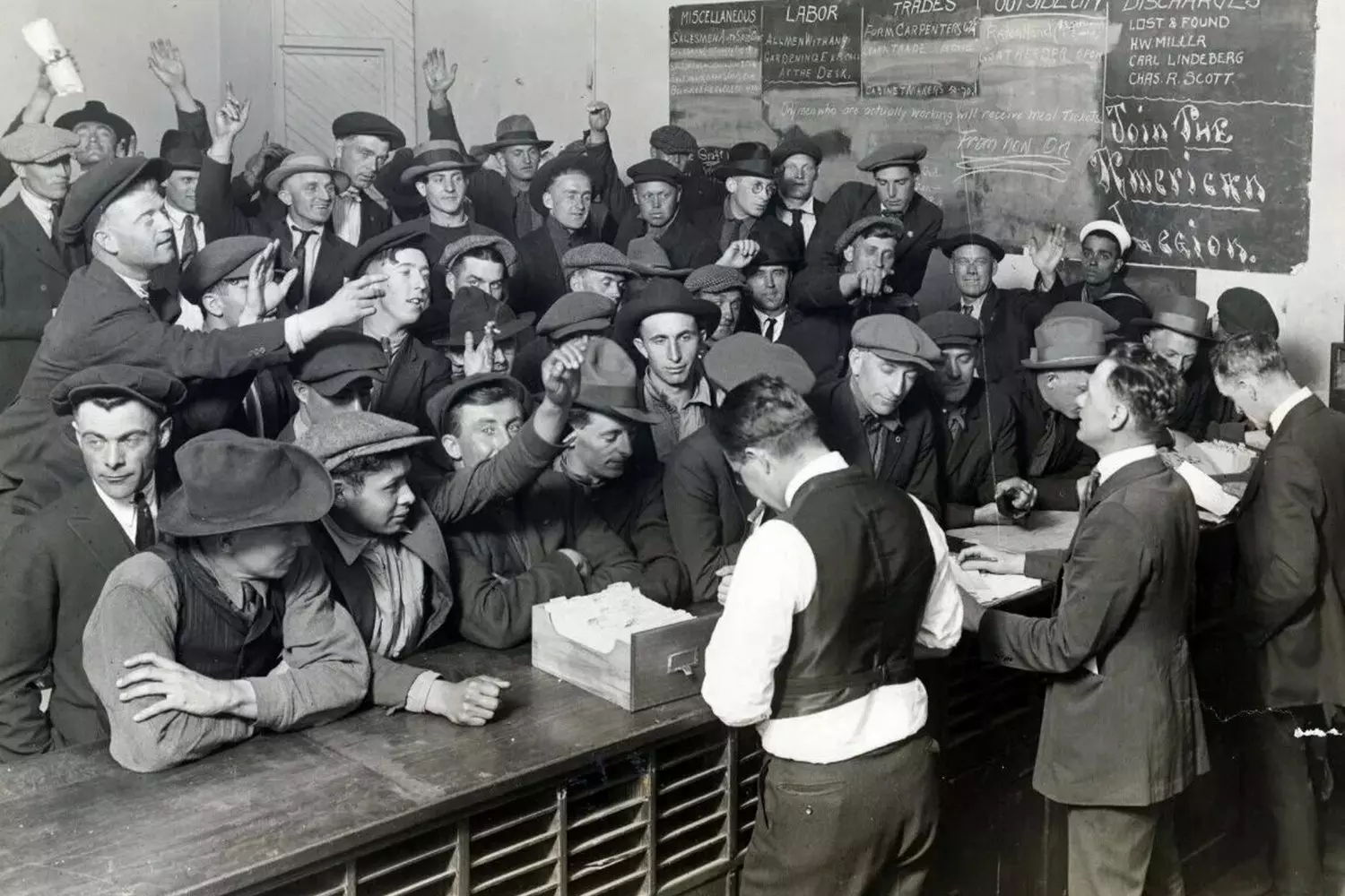 The Breadline Generation: Job Seekers During America's Darkest Economic Crisis A long line of unemployed men waiting outside an employment office during the Great Depression, 1930s