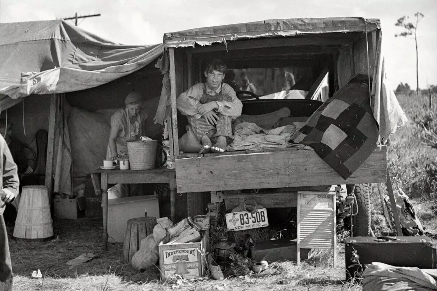 Nomadic Survival: A Family's Life in a Truck During the Dust Bowl Era A migrant family living in their truck during the Great Depression, 1930s