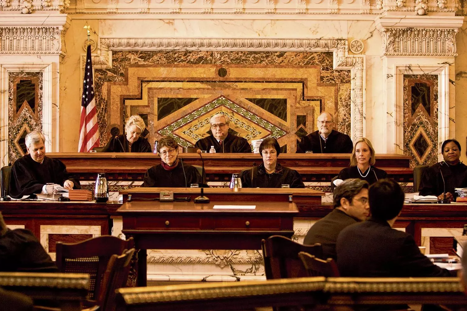 U.S. Judges in Courtroom — American Judiciary System in Action Judges in black robes presiding in a courtroom, symbolizing law and order in the United States