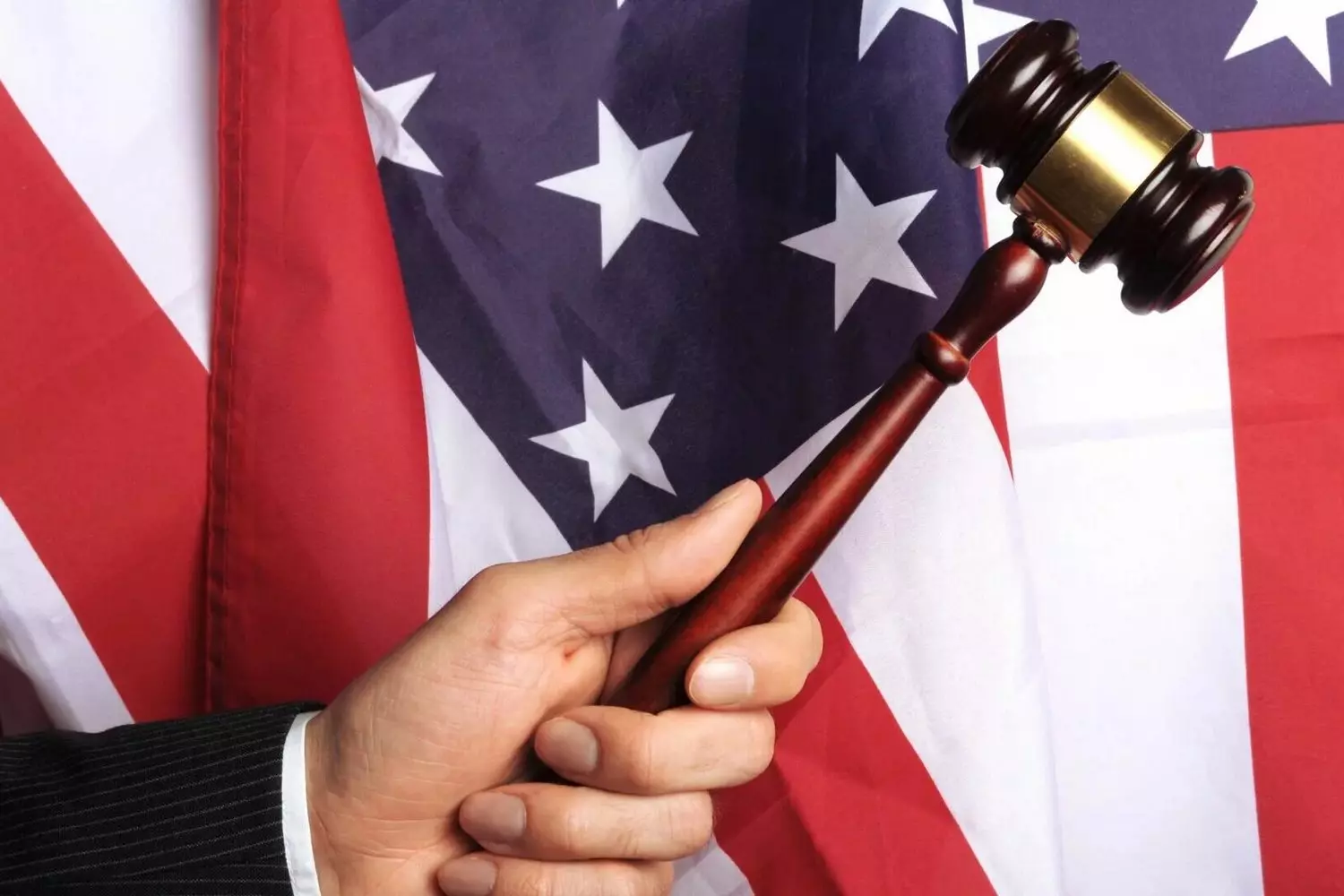 Gavel on U.S. Flag — Power of American Justice and Legal Authority A judge’s gavel held over an American flag, representing court decisions and the rule of law in the USA