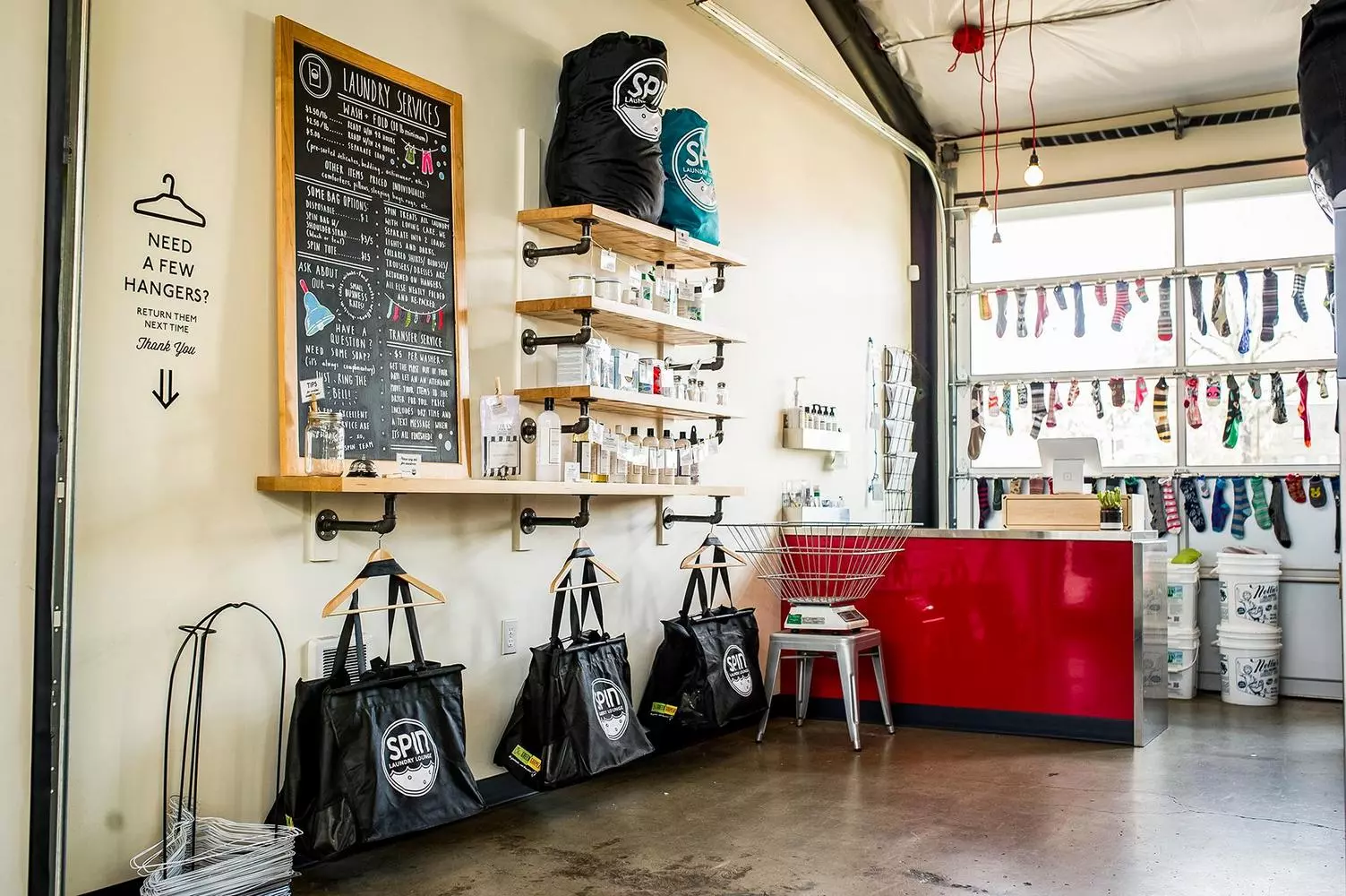 More Than Just Spin Cycles: Why American Laundromats Are Cultural Icons A vibrant laundromat in the USA with rows of washing machines, folding tables, and a cozy atmosphere — where laundry meets community