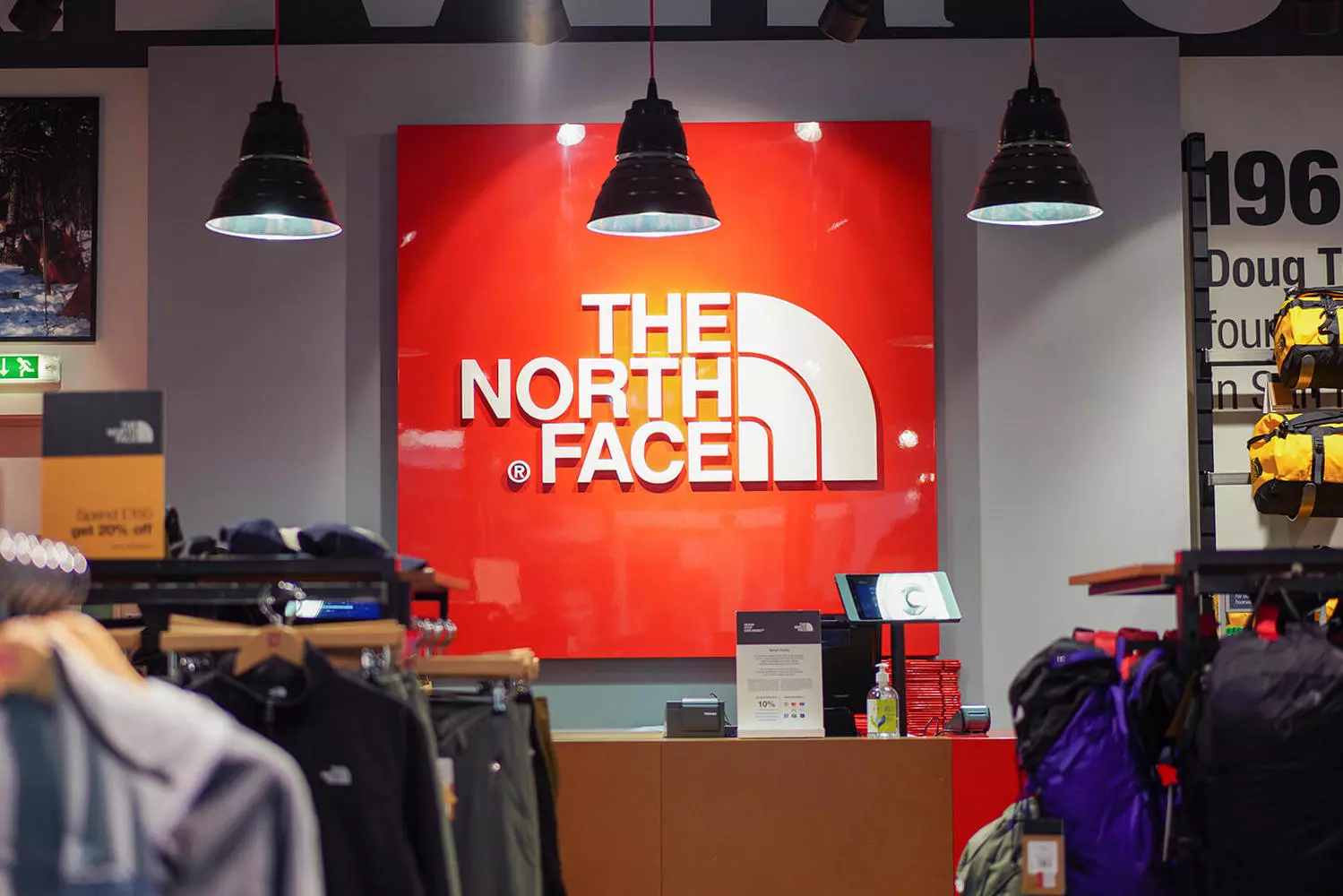 The North Face: Basecamp for Those Who Forge Their Own Path The North Face flagship store: expedition-themed window displays with mannequins in puffer jackets, wooden design elements inspired by mountain huts
