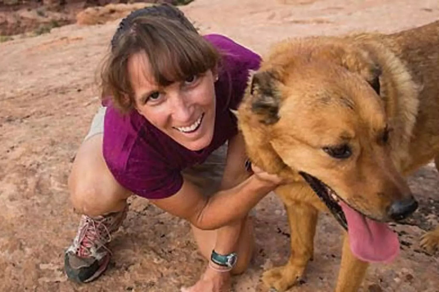Danelle Ballengee and Taz: The Incredible Survival Duo (Colorado 2006) Danelle Ballengee with her heroic dog Taz after their survival story in Colorado's backcountry — woman and dog sitting together outdoors