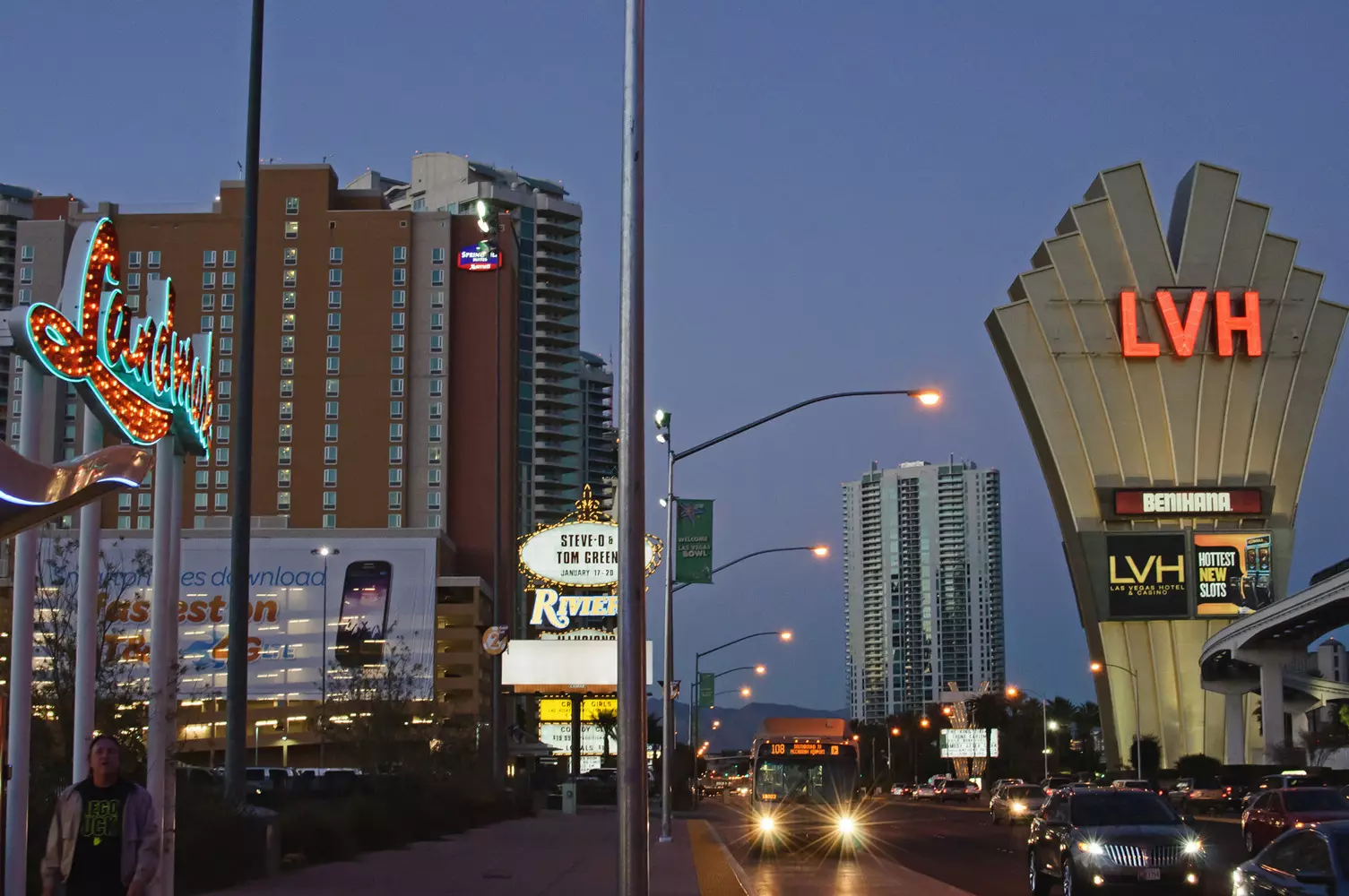 Las Vegas street scene with glowing casinos A vibrant street view of Las Vegas with illuminated casinos at night