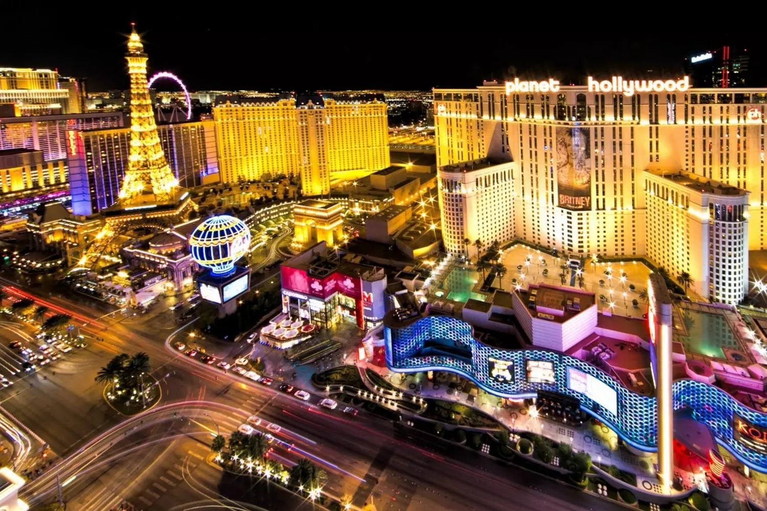 Las Vegas street scene with glowing casinos A vibrant street view of Las Vegas with illuminated casinos at night