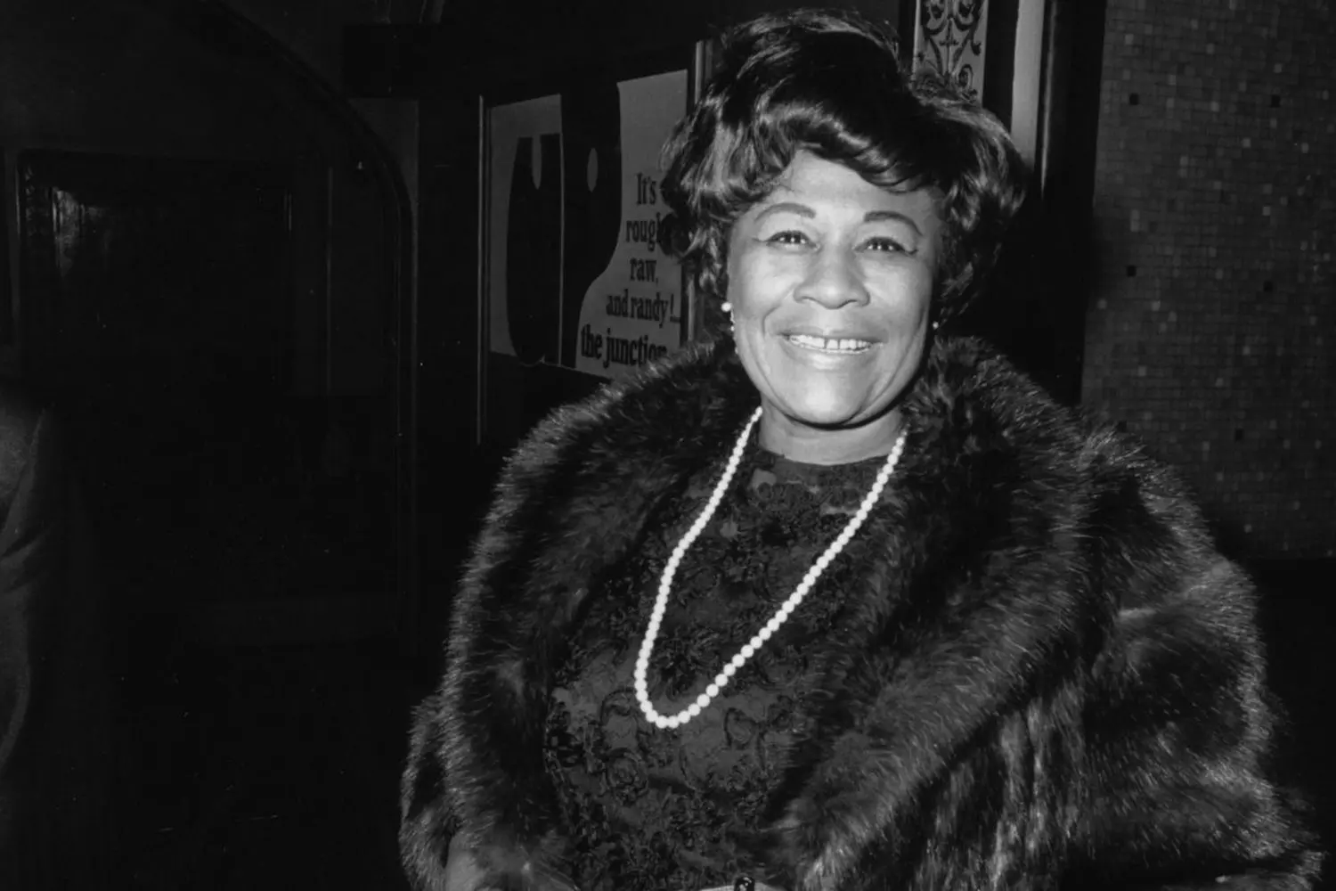 Ella Fitzgerald: The Timeless Voice of Jazz Black-and-white portrait of jazz legend Ella Fitzgerald smiling warmly