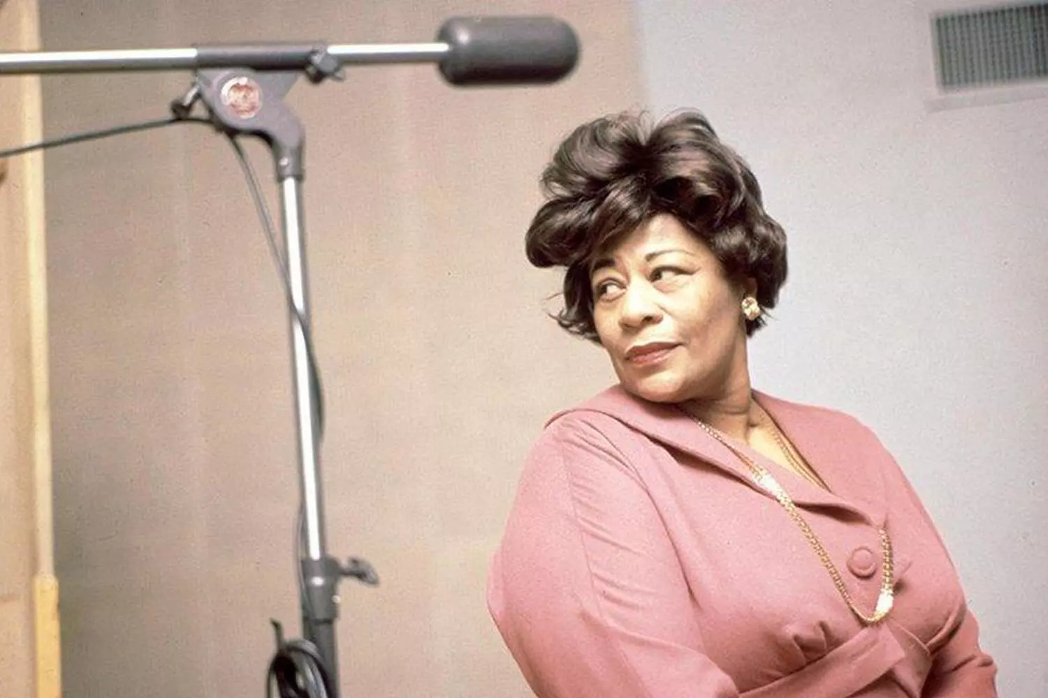 Ella Fitzgerald: The Timeless Voice of Jazz Ella Fitzgerald performing on stage with a microphone, mid-song, exuding passion and energy