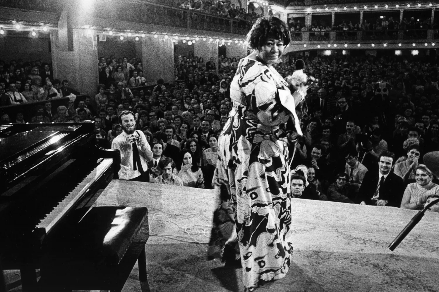 Ella Fitzgerald: The Timeless Voice of Jazz Ella Fitzgerald performing on stage with a microphone, mid-song, exuding passion and energy