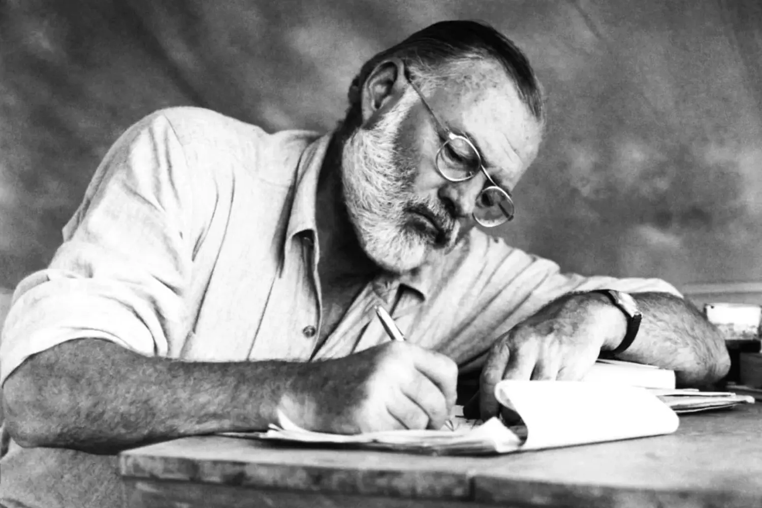 Ernest Hemingway at work Ernest Hemingway engaged in writing