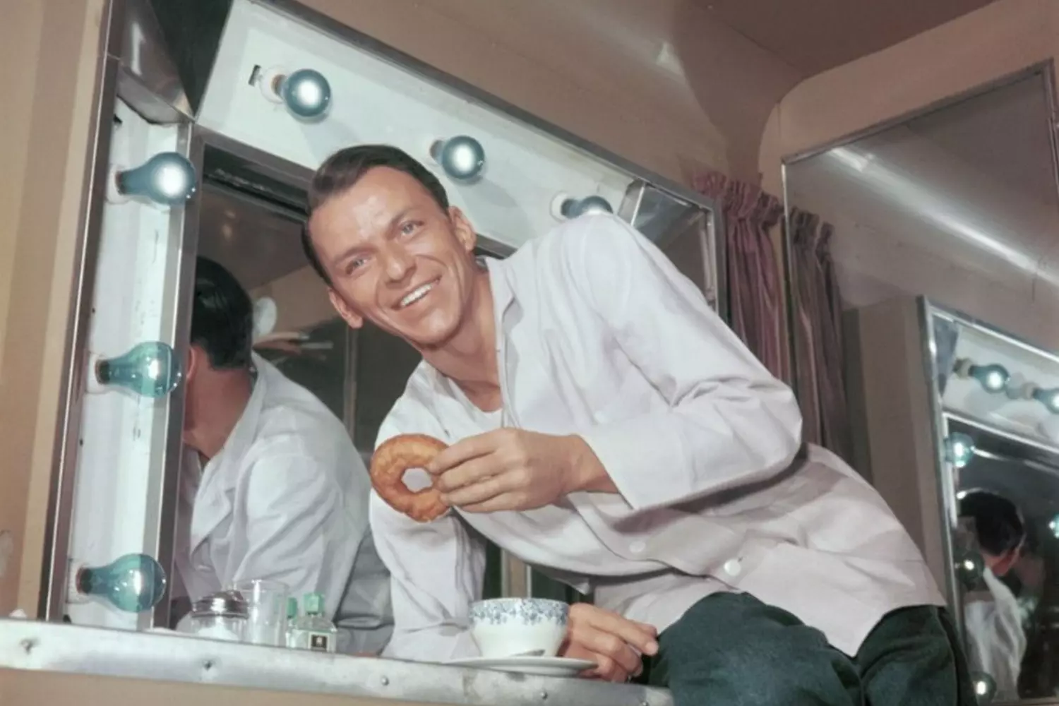 Frank Sinatra smiling while recording in the studio Young Sinatra smiling during a studio recording session