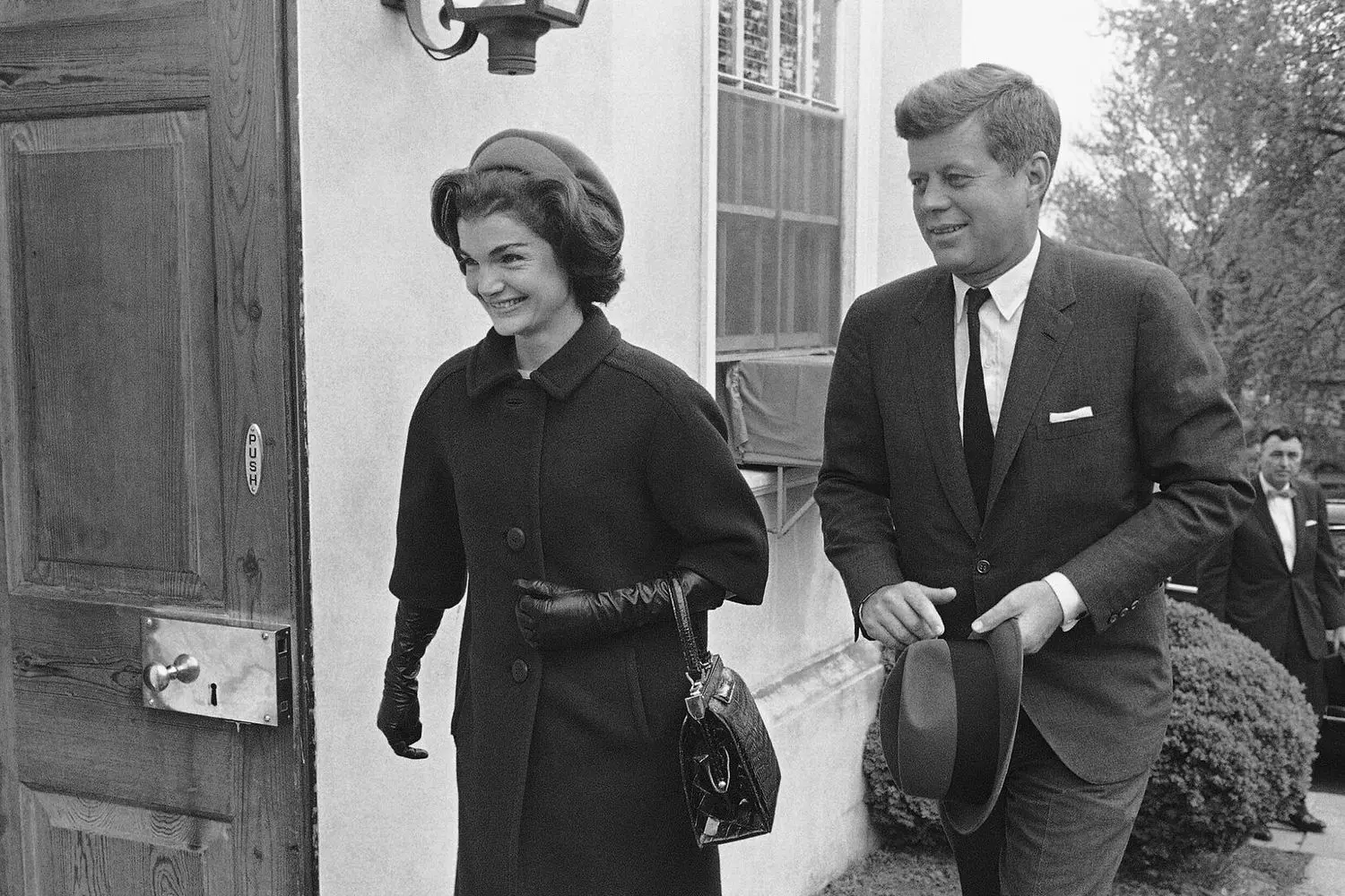 John & Jacqueline Kennedy: A White House Love Story President John F. Kennedy and First Lady Jacqueline Kennedy: A Rare Candid Moment During an Official Event