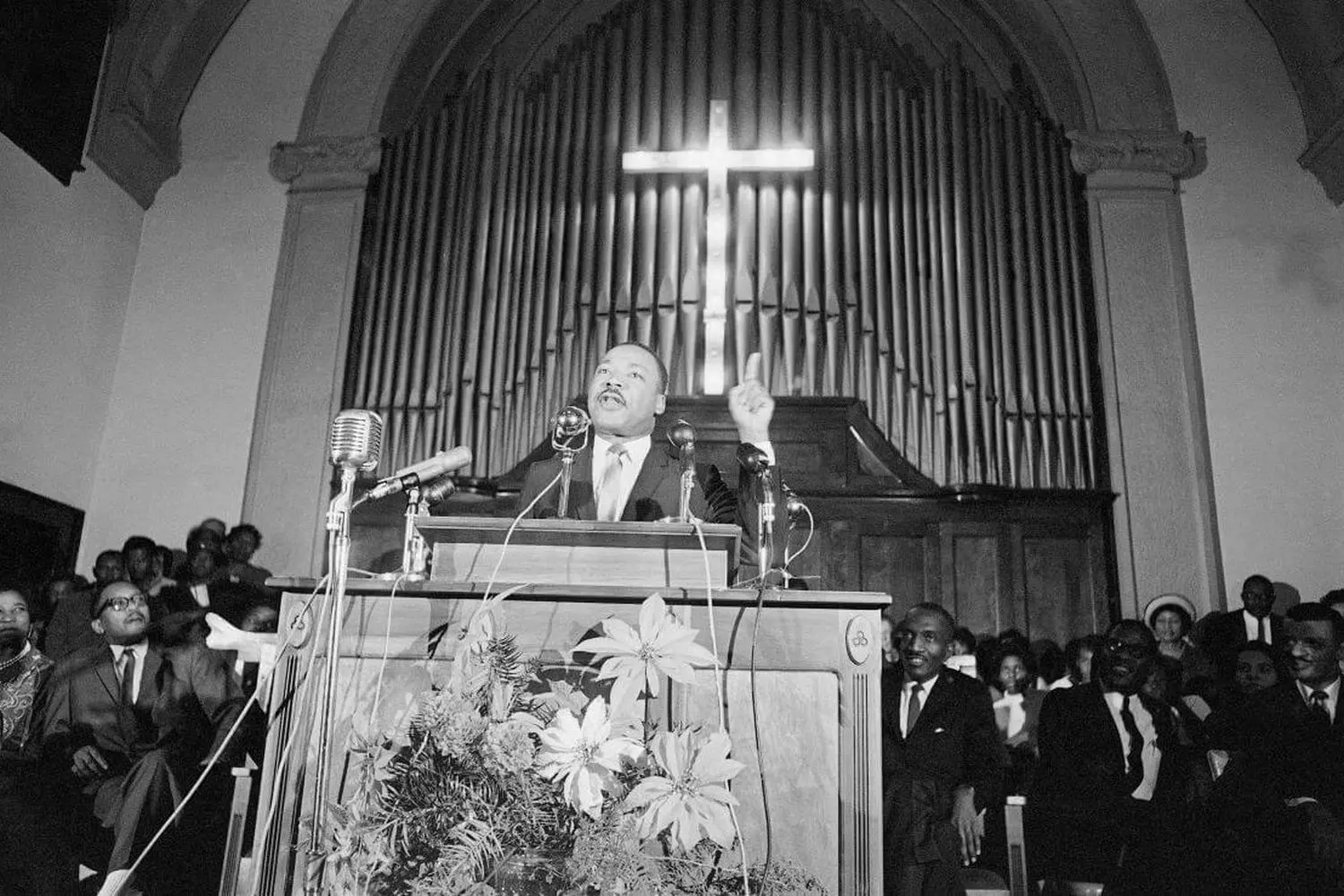 Dr. Martin Luther King Jr.: Preaching Justice Martin Luther King Jr. delivers a speech in a church, surrounded by congregants