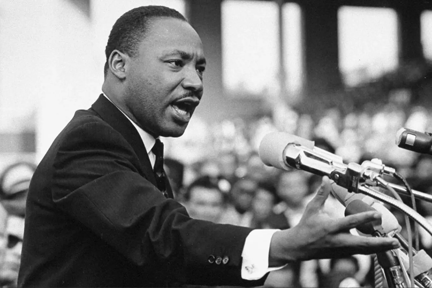 Martin Luther King Jr. at the Microphone: A Fiery Speech for Freedom Martin Luther King Jr. stands at a microphone, passionately delivering a speech